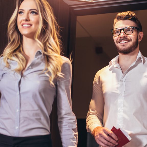 Vacation for couple. Young couple entering the hotel room together